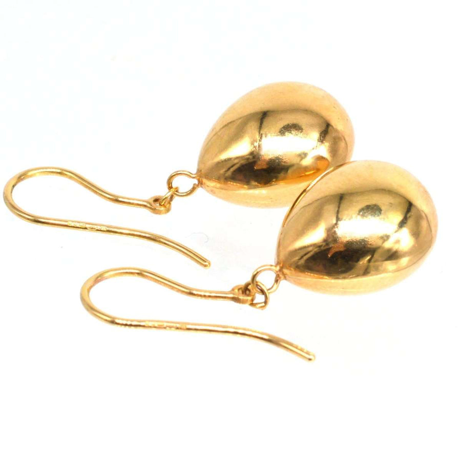 1940s 9ct gold earrings with large teardrop design, showcasing mid-century elegance and sophistication.