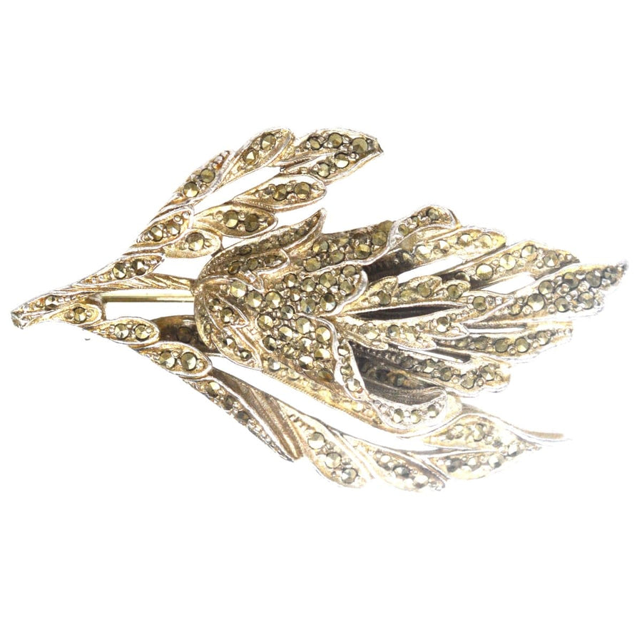 1940s chrome brooch featuring marcasite floral design, resembling rose cut diamonds, perfect for vintage jewelry lovers.