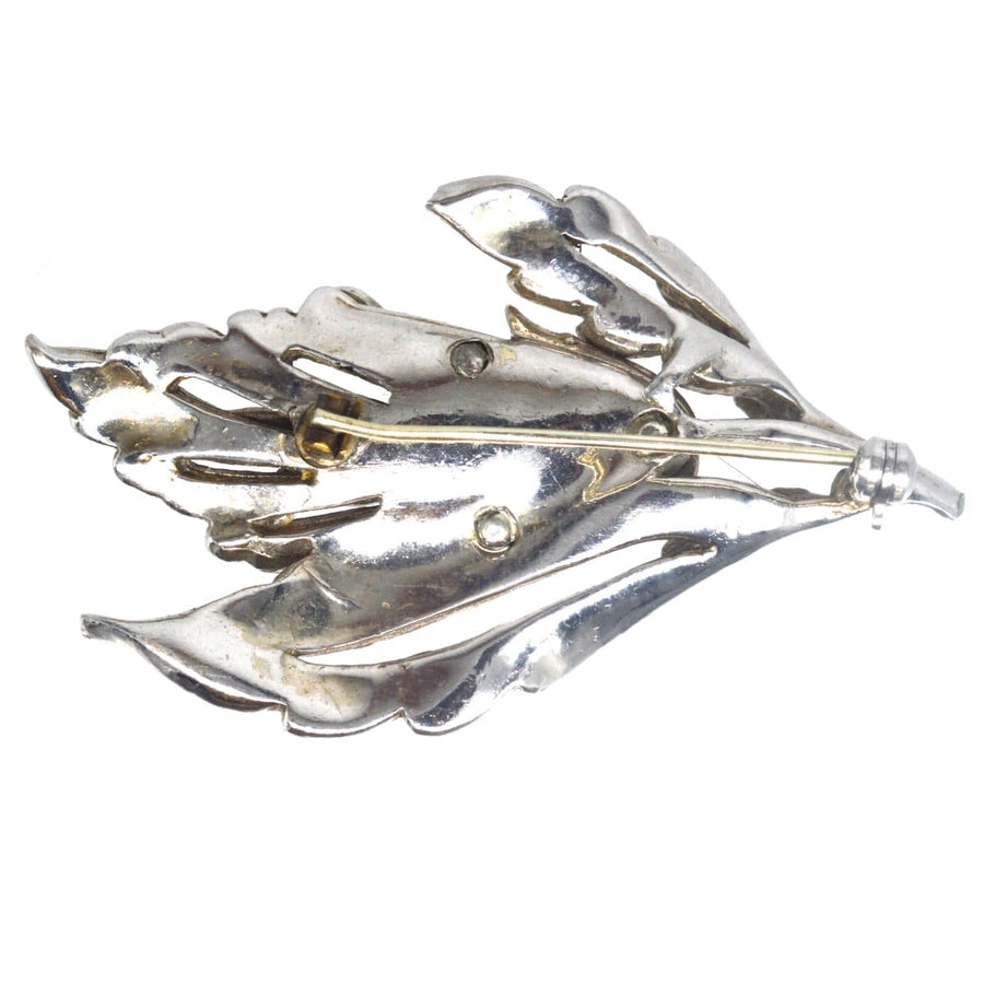 1940s chrome and marcasite floral brooch featuring intricate leaf design, capturing the elegance of vintage jewelry.