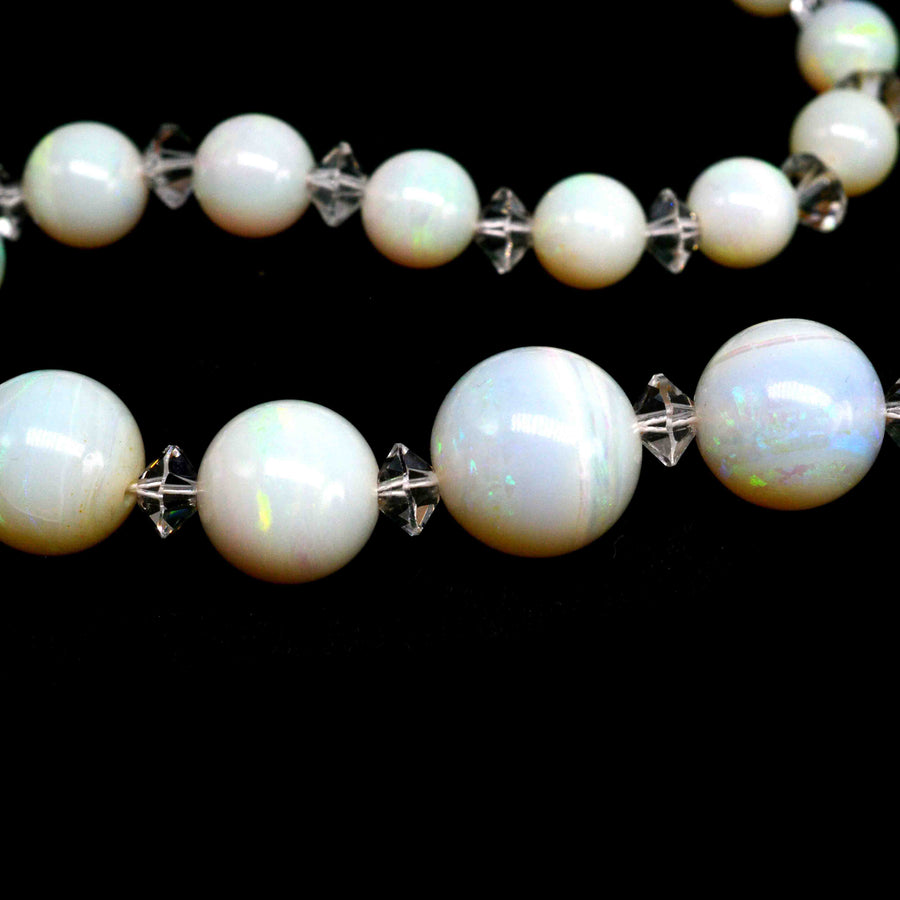 Early 20th Century Graduated Opal Bead Necklace with Ruby and Moonstone Clasp