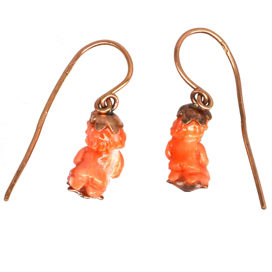 Georgian 12ct gold earrings with coral Cupid figures, showcasing Regency-era craftsmanship and romantic design.