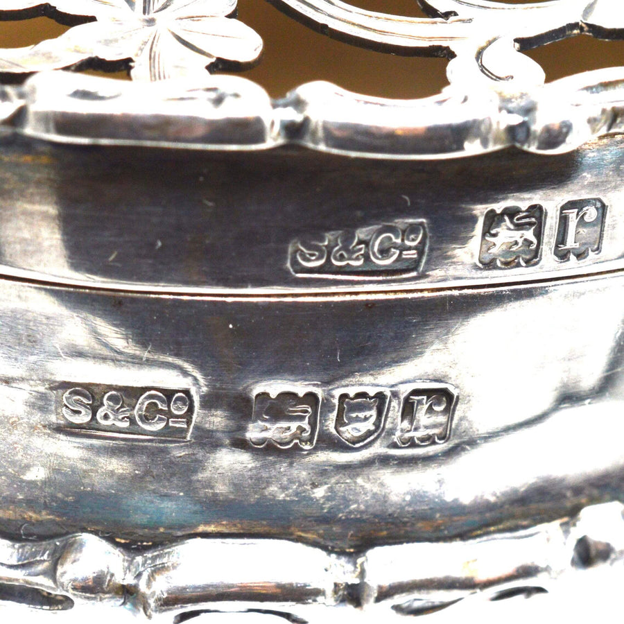 Close-up of hallmarks on Edwardian sterling silver trinket box by Skinner & Co., London 1912.