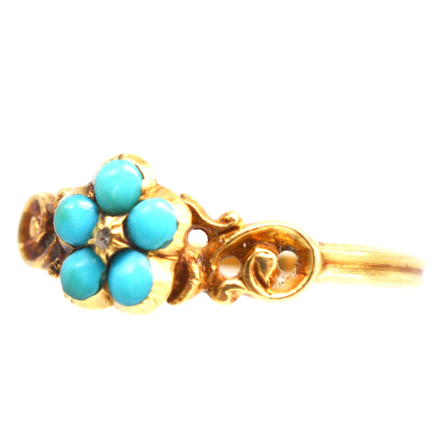 Georgian William IV 18ct gold ring featuring a turquoise Forget-Me-Not flower design with diamond accents.