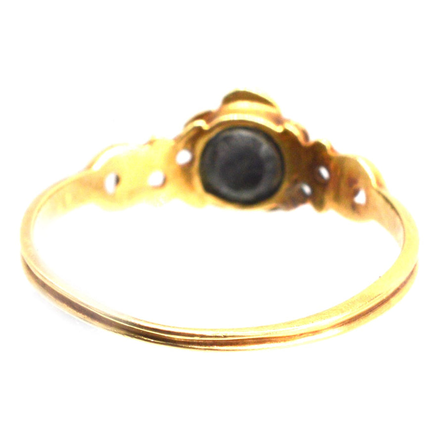 Georgian 18ct gold ring featuring a delicate five-petal design with a central turquoise flower.