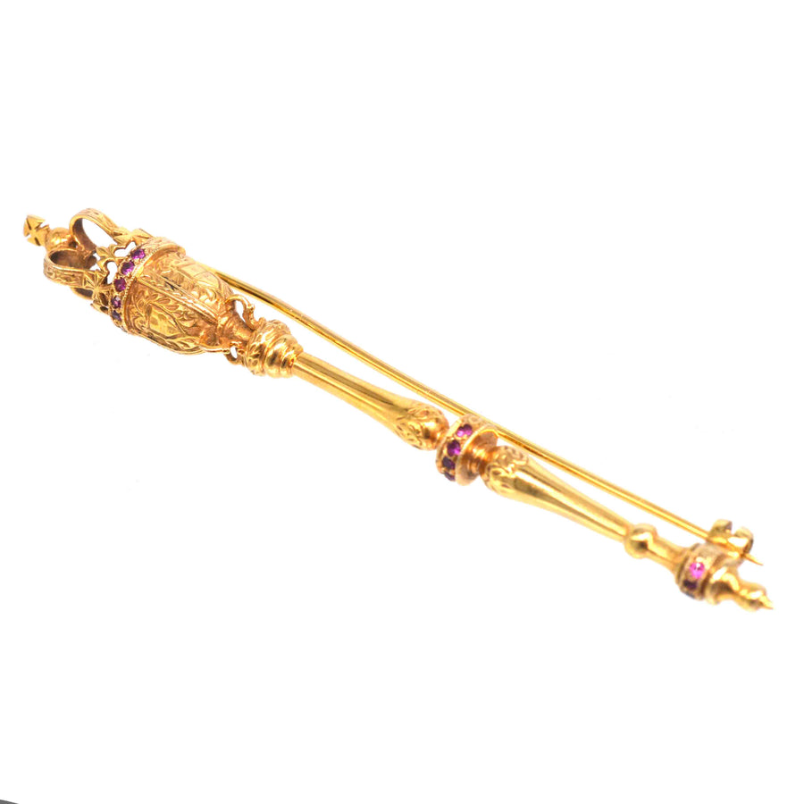 Vintage 9ct gold royal mace brooch with rubies, symbolizing power and British tradition from 1975.