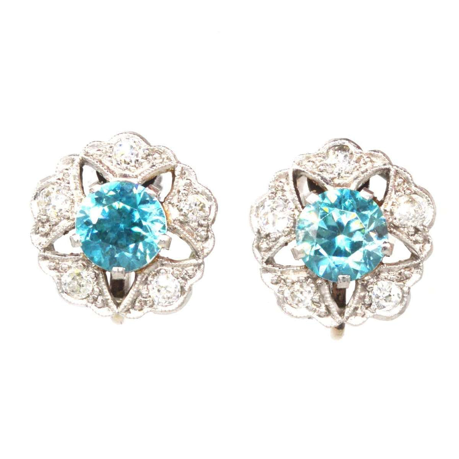 Art Deco 9ct white gold earrings featuring blue zircon and diamond clusters in a starburst design.