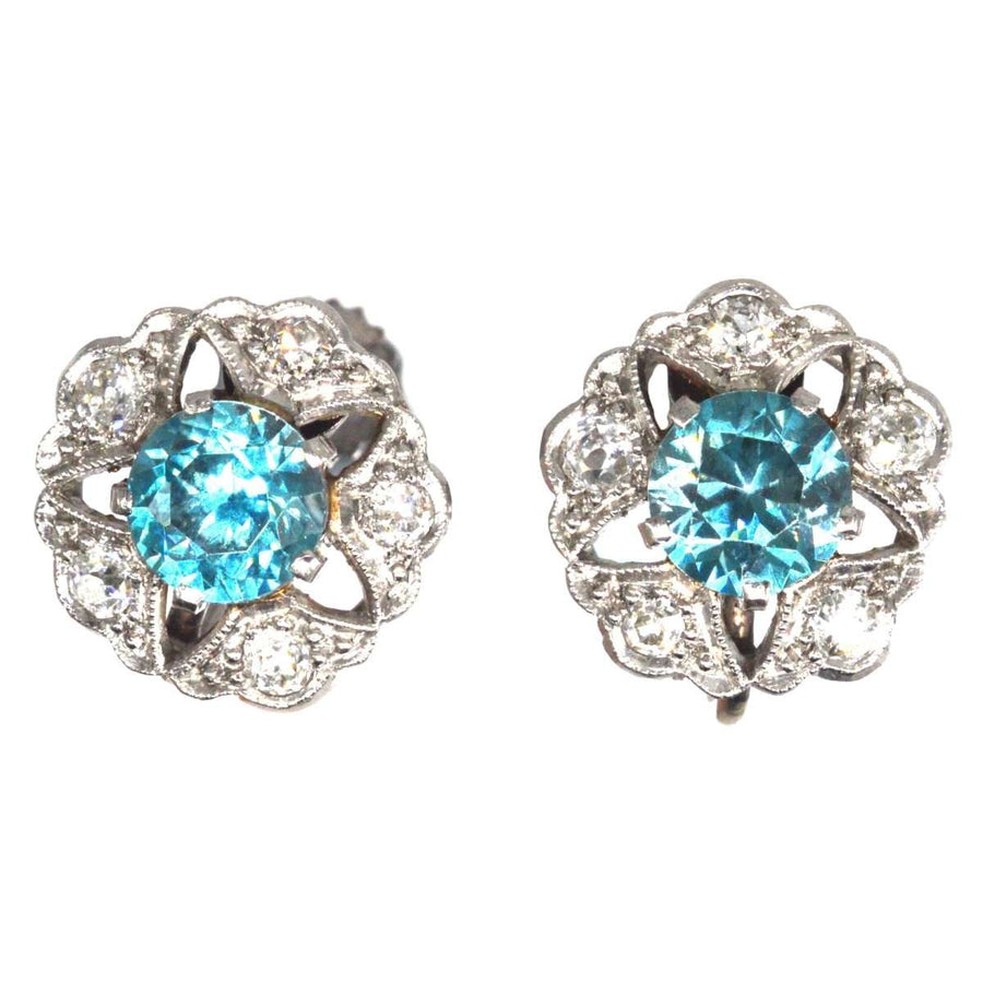 Art Deco 9ct white gold earrings featuring blue zircon and diamond clusters in a starburst design.