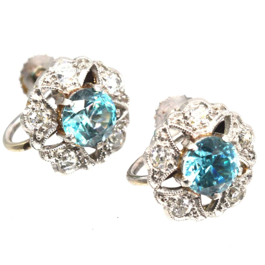 Art Deco 9ct white gold earrings featuring blue zircon and diamond clusters in starburst design.