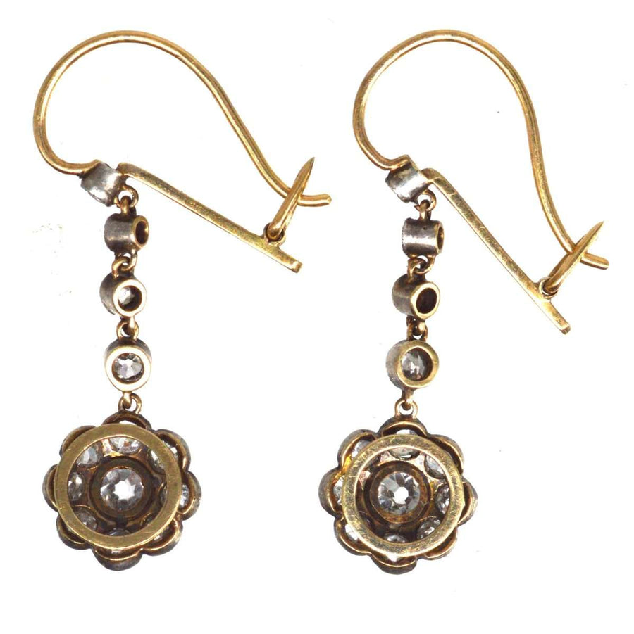 Edwardian 18ct gold and platinum diamond cluster drop earrings with delicate milgrain detailing.
