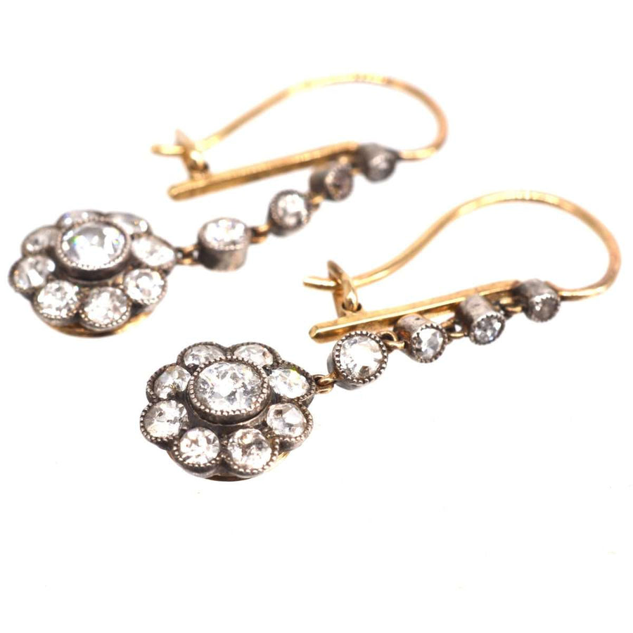 Edwardian 18ct gold and platinum diamond cluster drop earrings, vintage style with milgrain detail, perfect for any outfit.