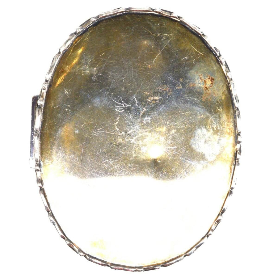 Back view of an Edwardian sterling silver oval trinket box, featuring intricate craftsmanship and vintage patina.