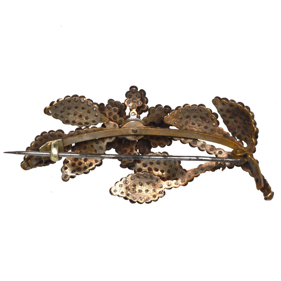 Georgian cut steel floral brooch featuring intricate, lifelike design with polished steel studs for a sparkling effect.