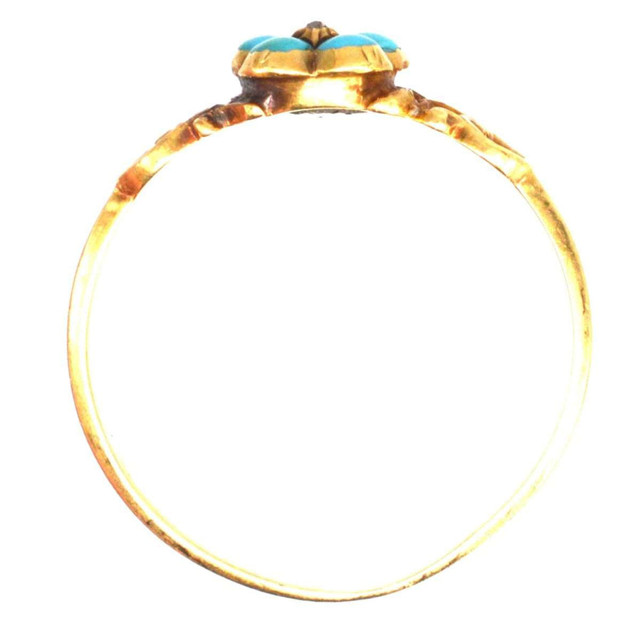 Georgian William IV 18ct gold ring featuring a turquoise flower motif, symbolizing remembrance and enduring affection.