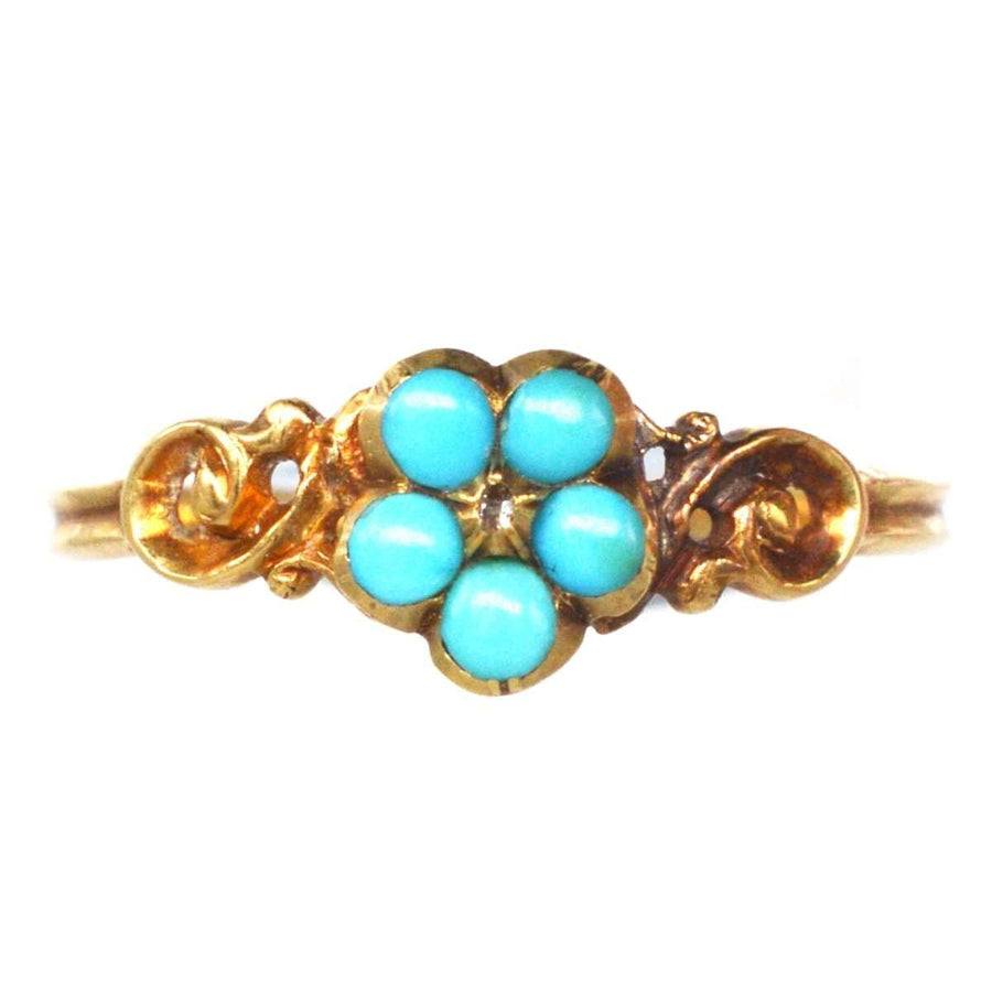 Georgian William IV 18ct gold cluster ring featuring turquoise flowers, symbolizing love and remembrance.
