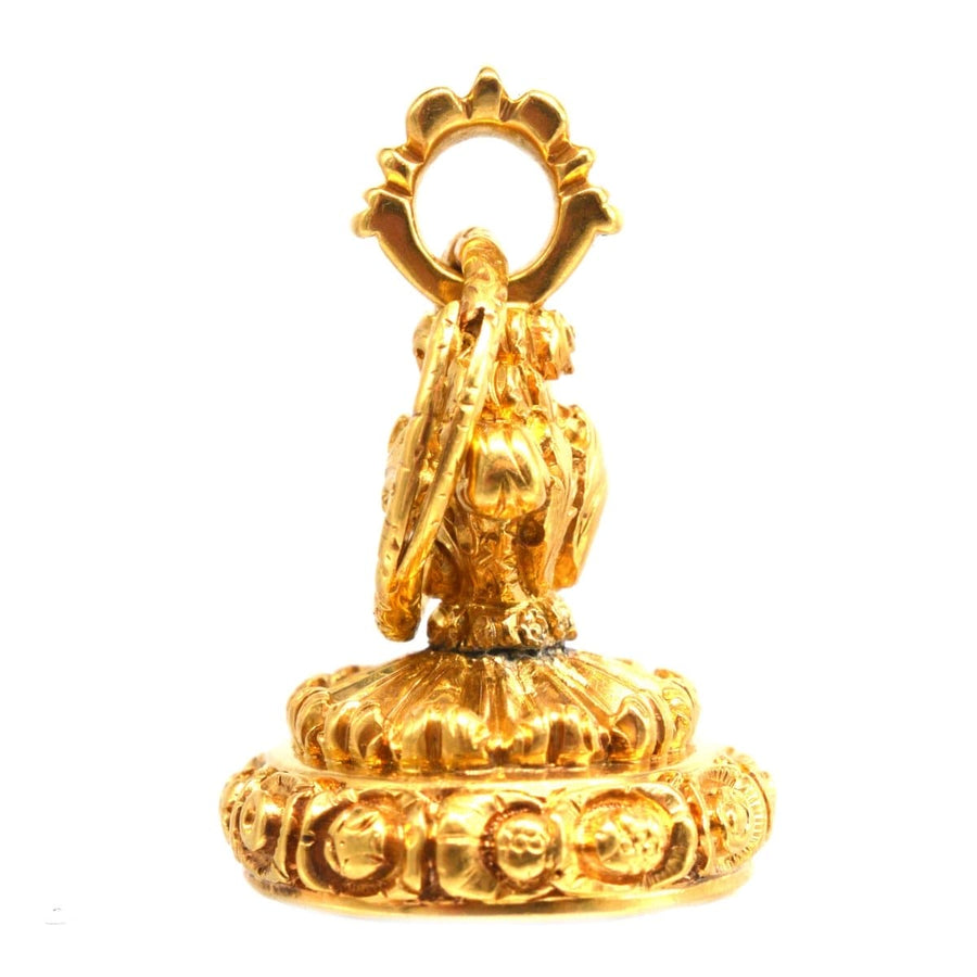 Georgian seal with intricate embossed details and a peacock crest on top, featuring a chalcedony base.