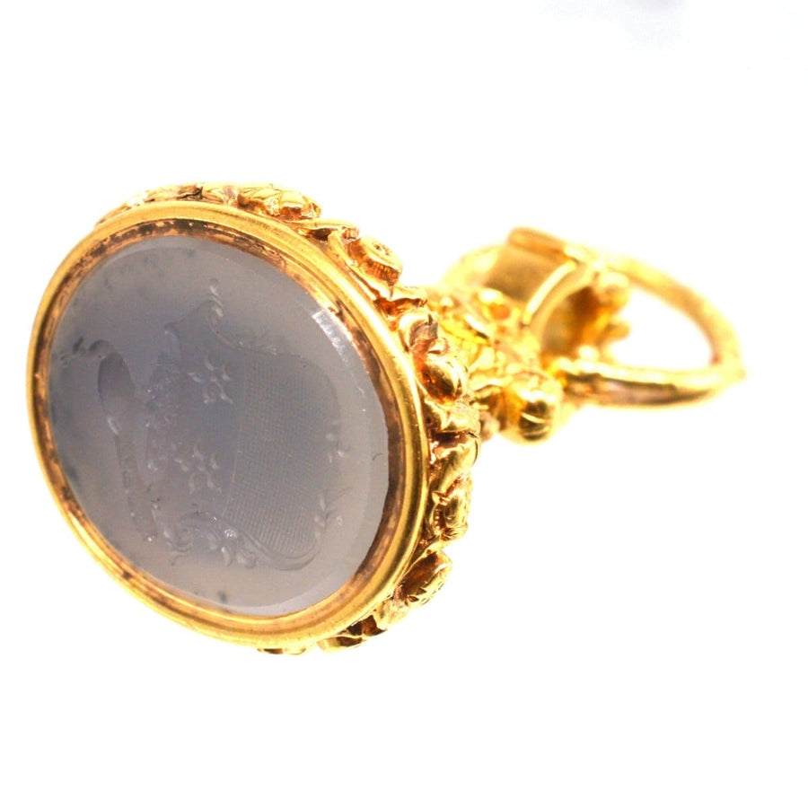 Large Georgian seal with chalcedony intaglio featuring a peacock crest and intricate gold detailing.