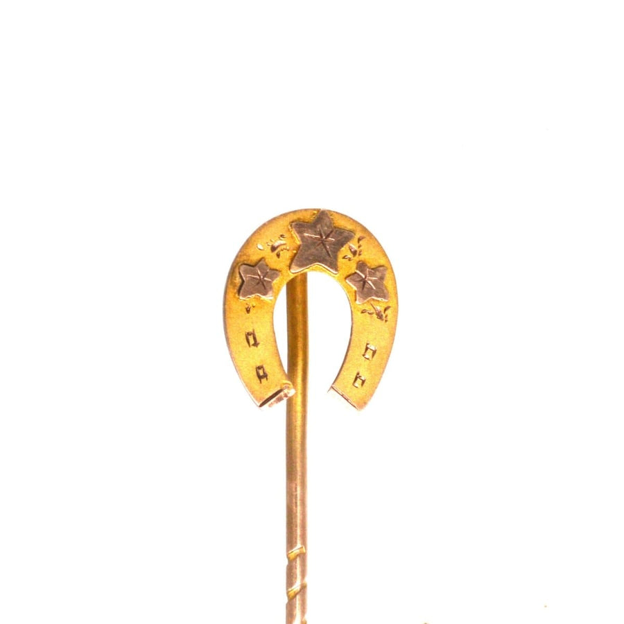 Late Victorian 9ct gold horseshoe tie pin with star accents, a symbol of good luck and devotion for weddings.