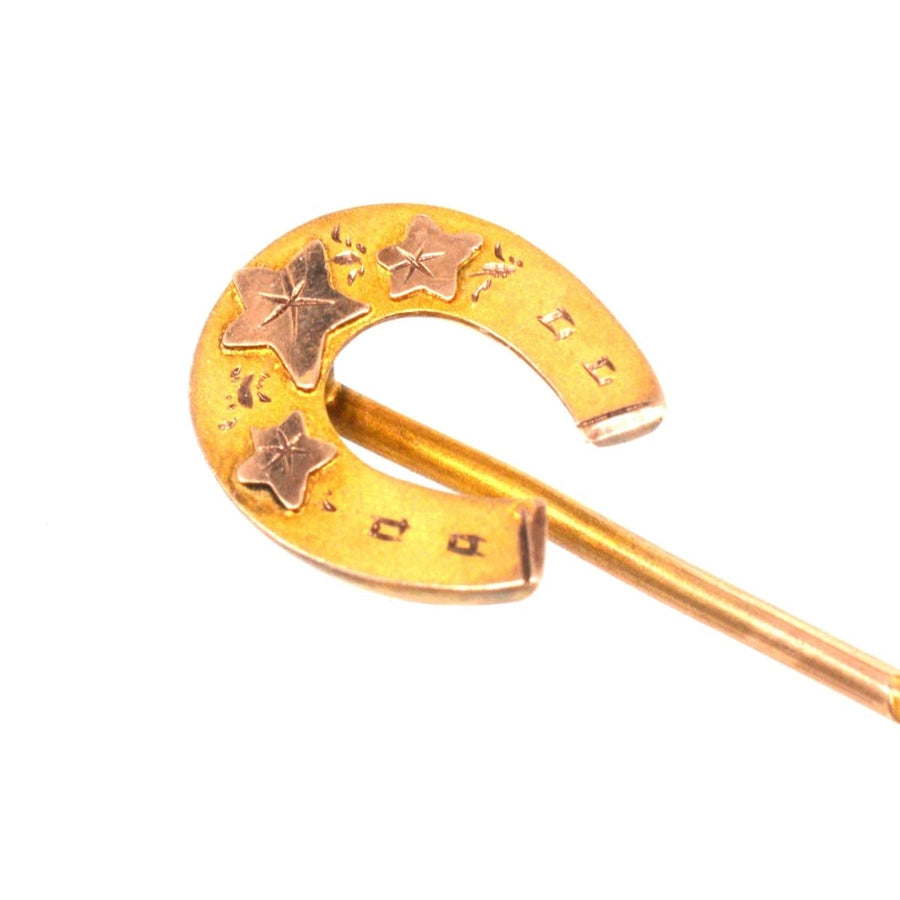 Late Victorian 9ct gold horseshoe tie pin with Ivy leaf design, symbolizing luck and devotion.