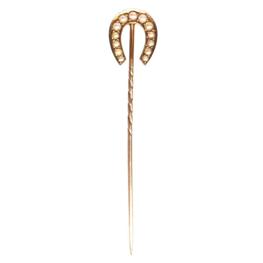 Late Victorian 9ct gold horseshoe tie pin with creamy seed pearls, symbolizing good luck from 1893.