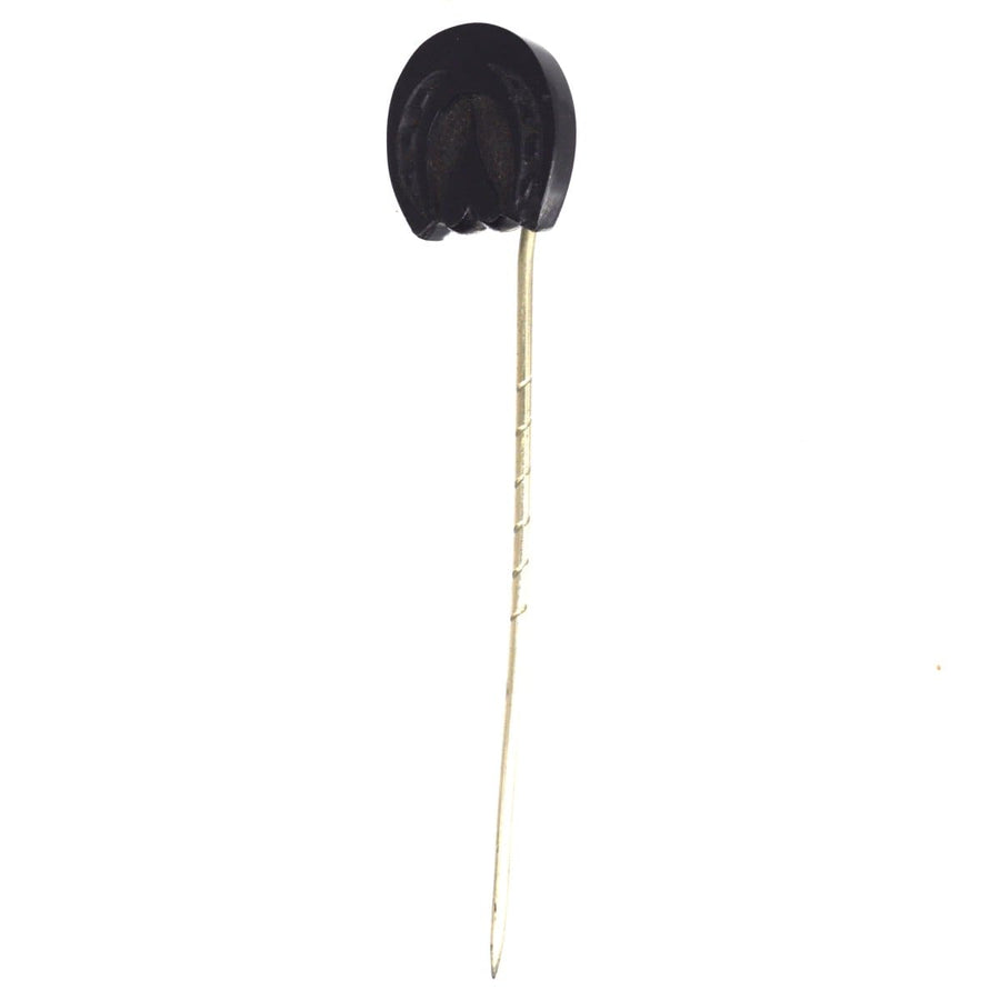 Late Victorian Whitby Jet horseshoe tie pin, featuring an upside-down heart shape, made from fossilized wood.