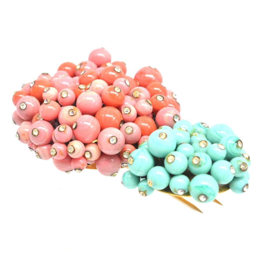 Rare Gripoix brooch featuring coral and turquoise glass paste with rhinestones, handcrafted in France, 1950s.