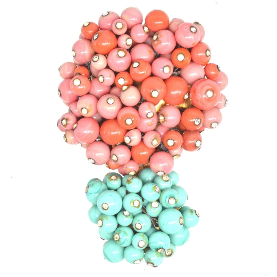Rare Gripoix brooch with coral and turquoise glass beads, showcasing vintage craftsmanship from the 1950s.