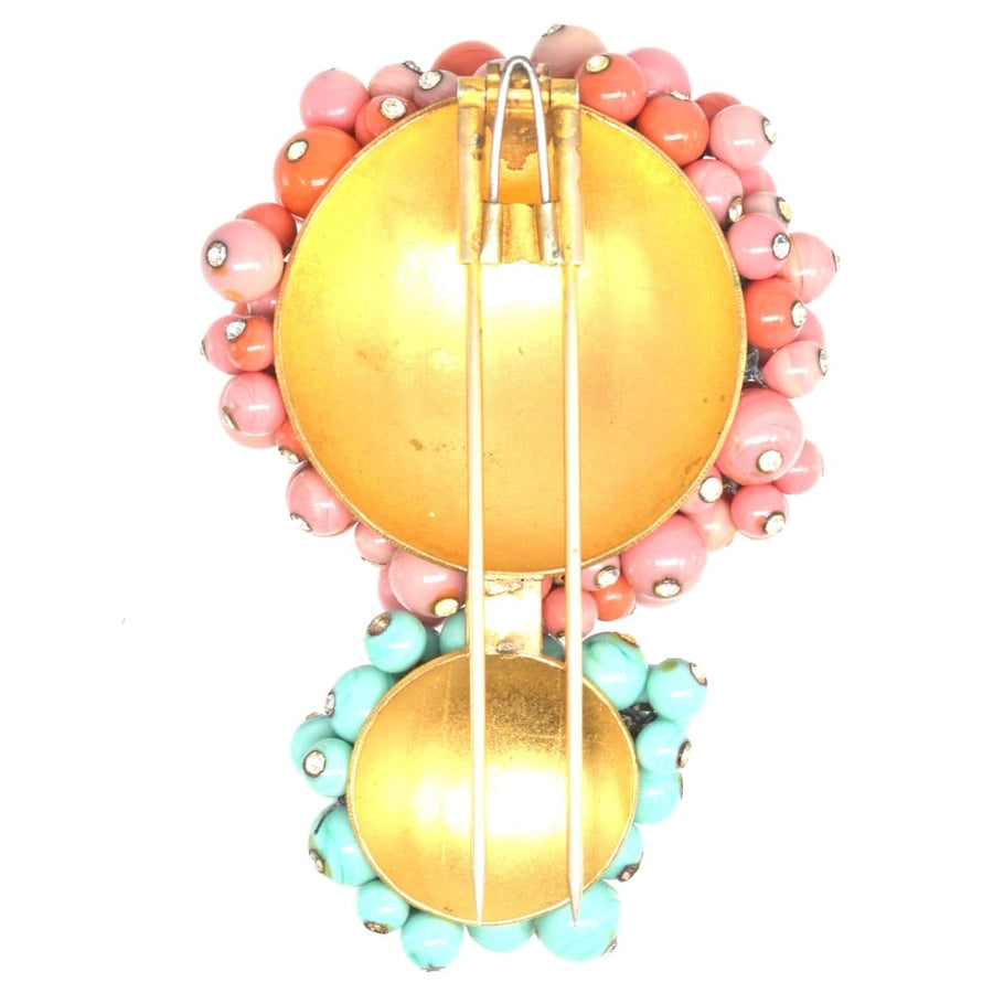 Vintage Gripoix brooch showcasing coral and turquoise glass paste with golden metal, 1950s handcrafted design.