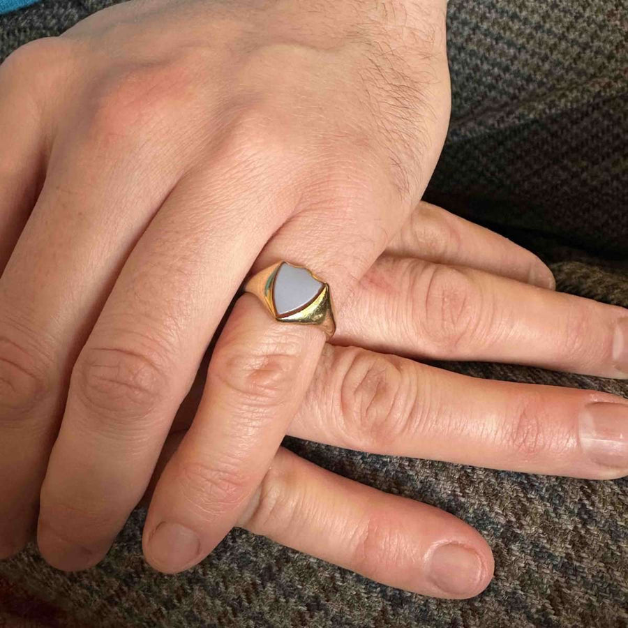 Victorian 18ct gold signet ring with carnelian stone worn on a hand, showcasing its elegant design.