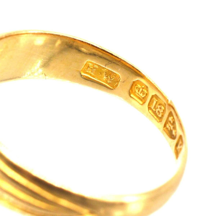 Close-up of Victorian 18ct gold ring showing hallmark and purity marks from Chester, England, 1893.