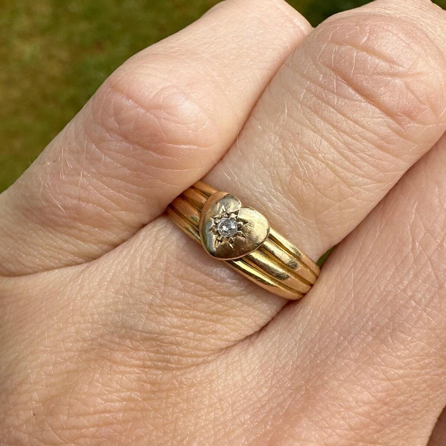 Victorian 18ct gold band keeper ring featuring a heart and diamond, showcasing elegant detailing and sentimental value.