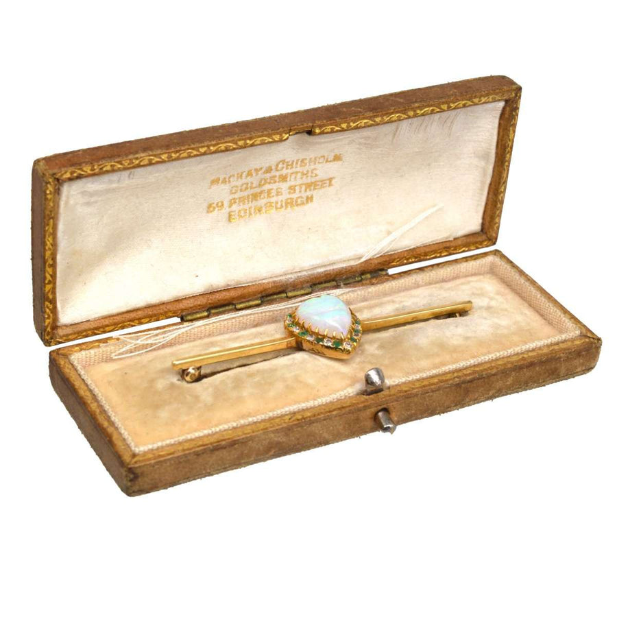 Victorian gold bar brooch with heart-shaped opal, diamonds, and emeralds in original box by Mackay & Chisholm.