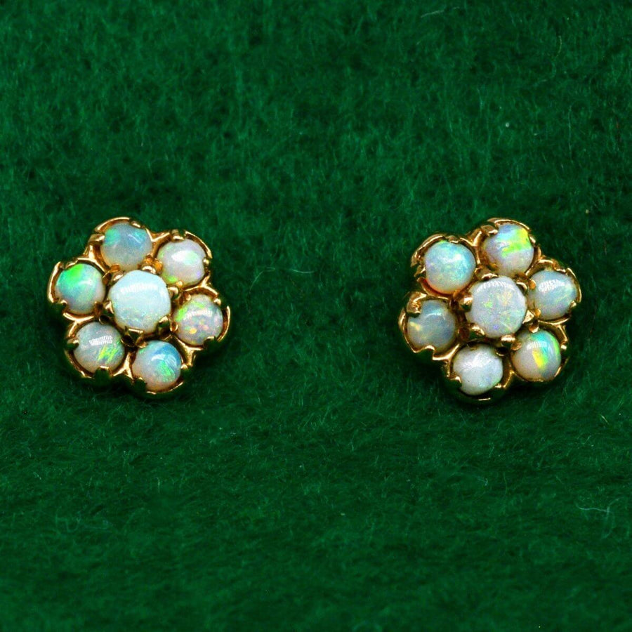 Vintage 9ct gold opal cluster stud earrings showcasing pastel play-of-colour, perfect for elegant wear.