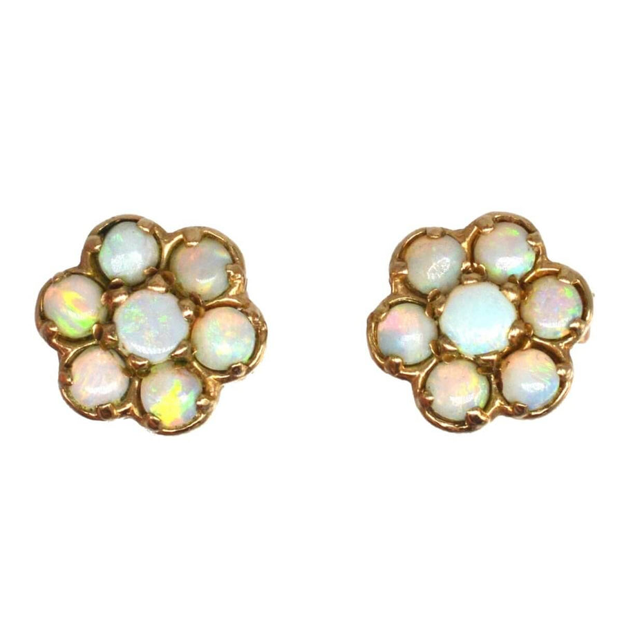 Vintage 9ct gold opal cluster stud earrings showcasing colorful natural opals in a flower design.