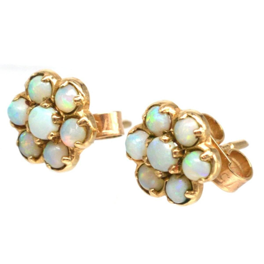 Vintage 9ct gold opal cluster stud earrings showcasing glowing natural opals in a classic design.