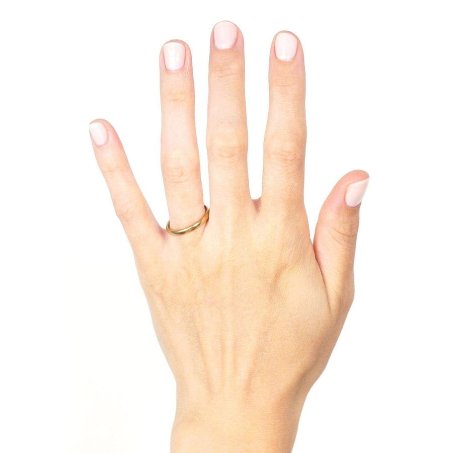 22ct gold wedding ring from the 1930s showcased on a hand, perfect for a timeless wedding or commitment.
