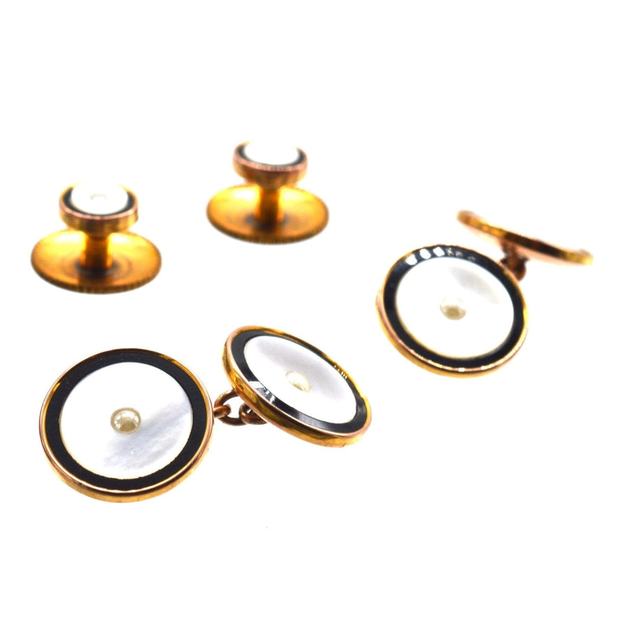 1930s Deco gold and onyx cufflinks with pearl detail, presented in a vintage black and white velvet box.