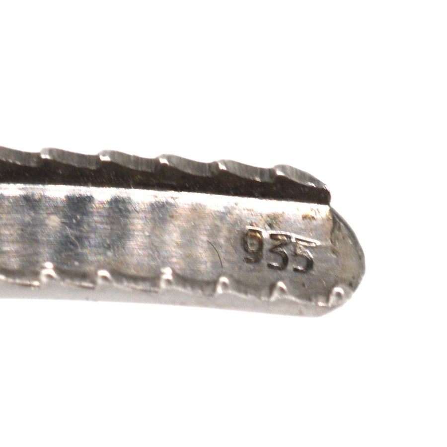 Detailed image of the hallmark 935 on a silver brooch, showcasing authentic vintage craftsmanship.