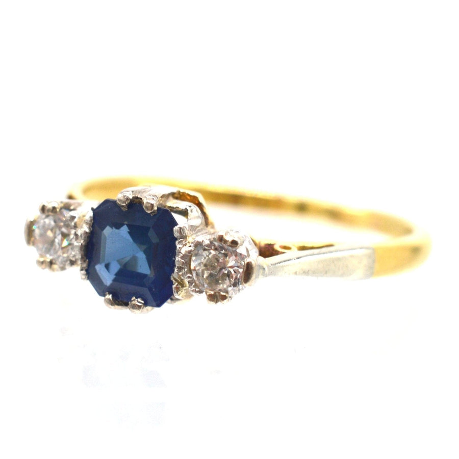 18ct gold and platinum three stone ring with Asscher cut sapphire and diamonds from the 1940s.