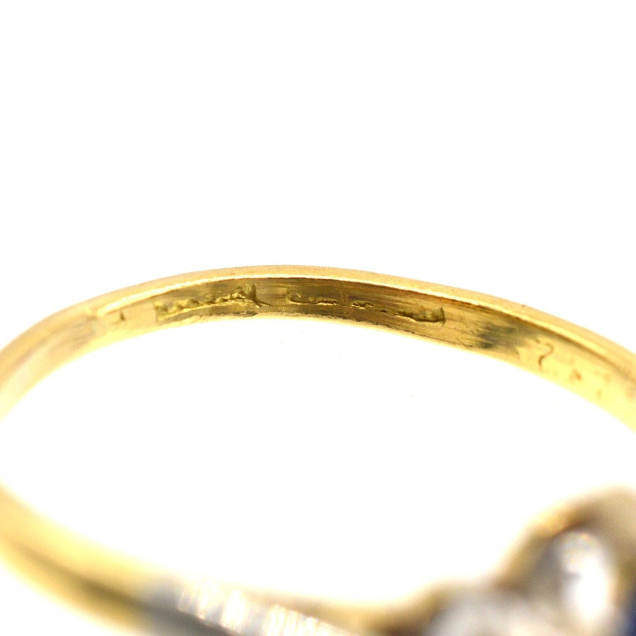 Close-up of the 1940s gold and platinum ring showcasing the hallmarks and intricate detailing on the band.