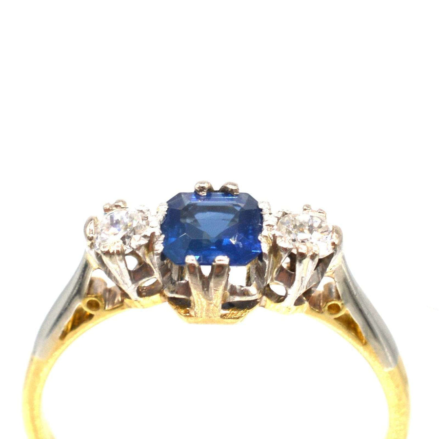1940s 18ct gold and platinum sapphire and diamond three stone ring featuring an Asscher cut sapphire.