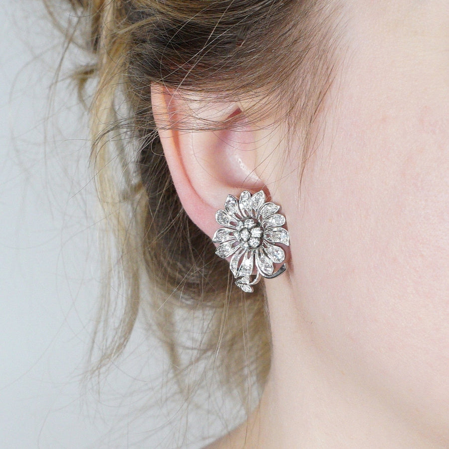 1940s 18ct white gold diamond flower cluster earrings with intricate diamond petals and central cluster.