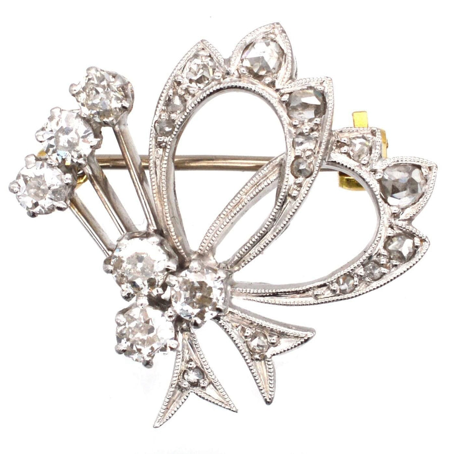 1940s 18ct white gold diamond bow motif brooch with one carat of old and rose cut diamonds.