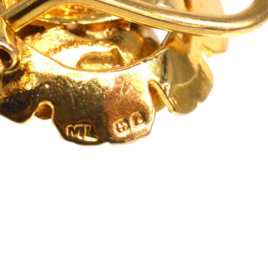 1940s 9ct gold flower clip on earrings with hallmarks, showcasing detailed craftsmanship and Birmingham origin.