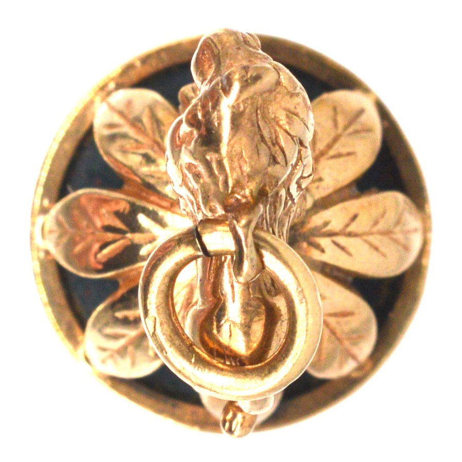 1940's 9ct gold pendant featuring a lion on a wreath and a bloodstone seal, vintage collectible jewelry.