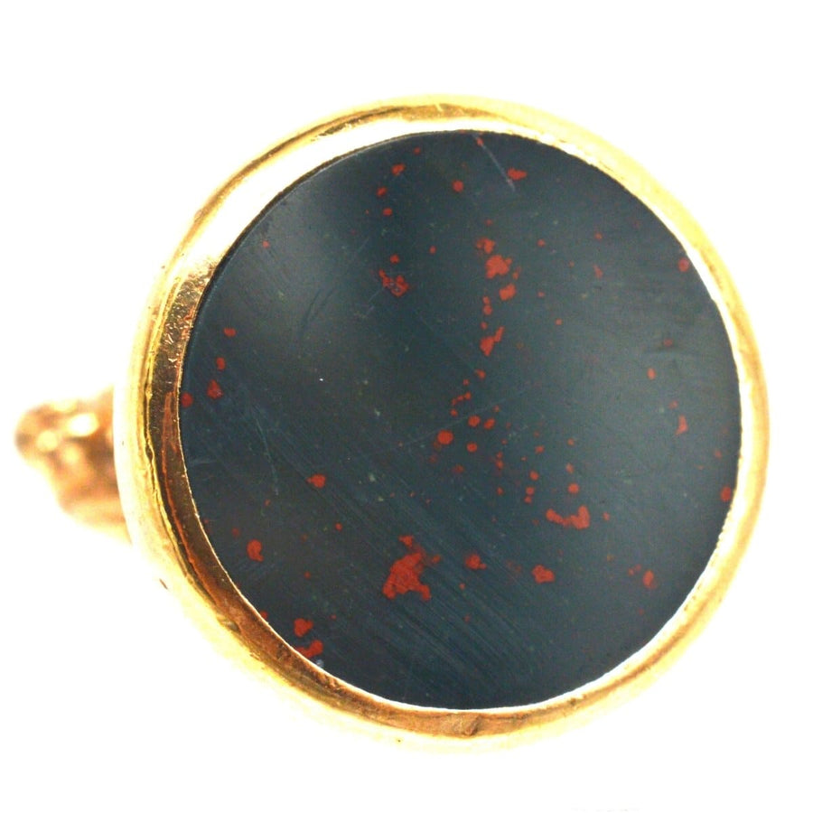 9ct gold ring featuring a large bloodstone seal with red speckles, a unique vintage jewelry piece.