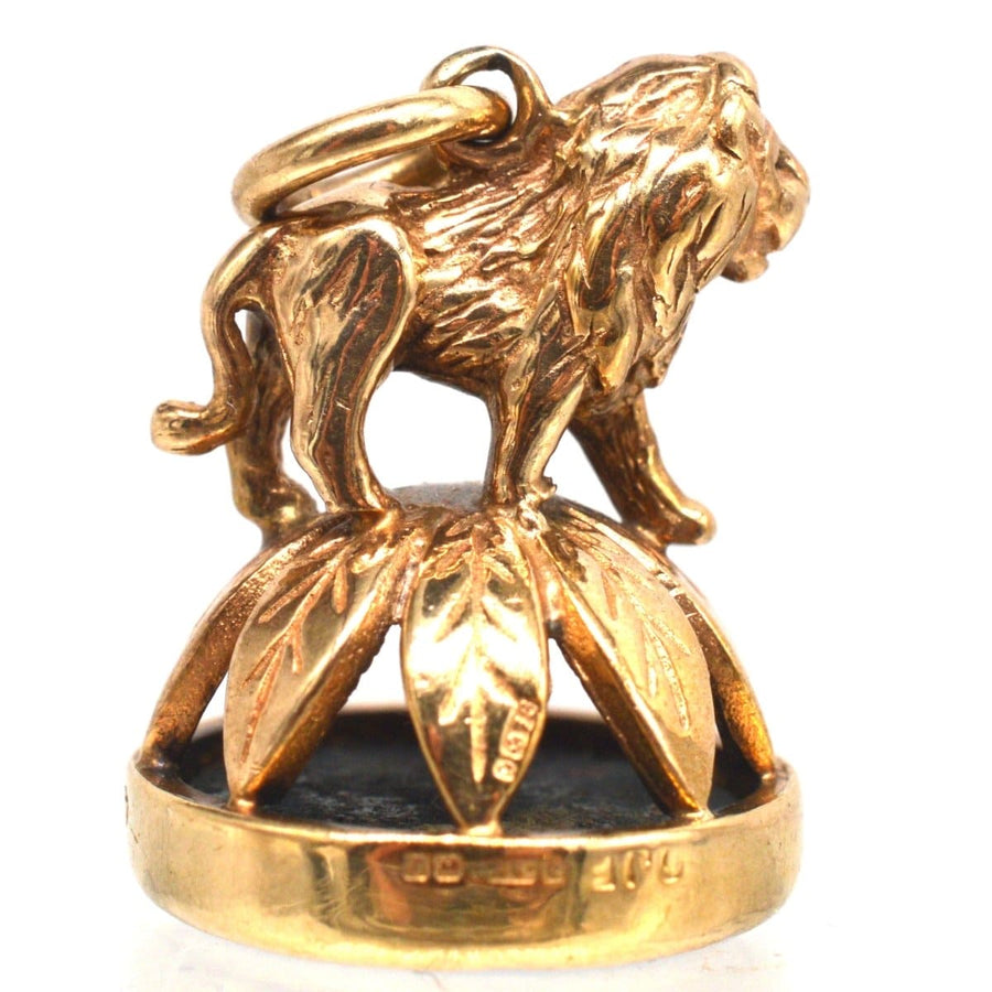 1940's 9ct gold pendant featuring a lion atop a wreath with a bloodstone seal, fully hallmarked and unique.