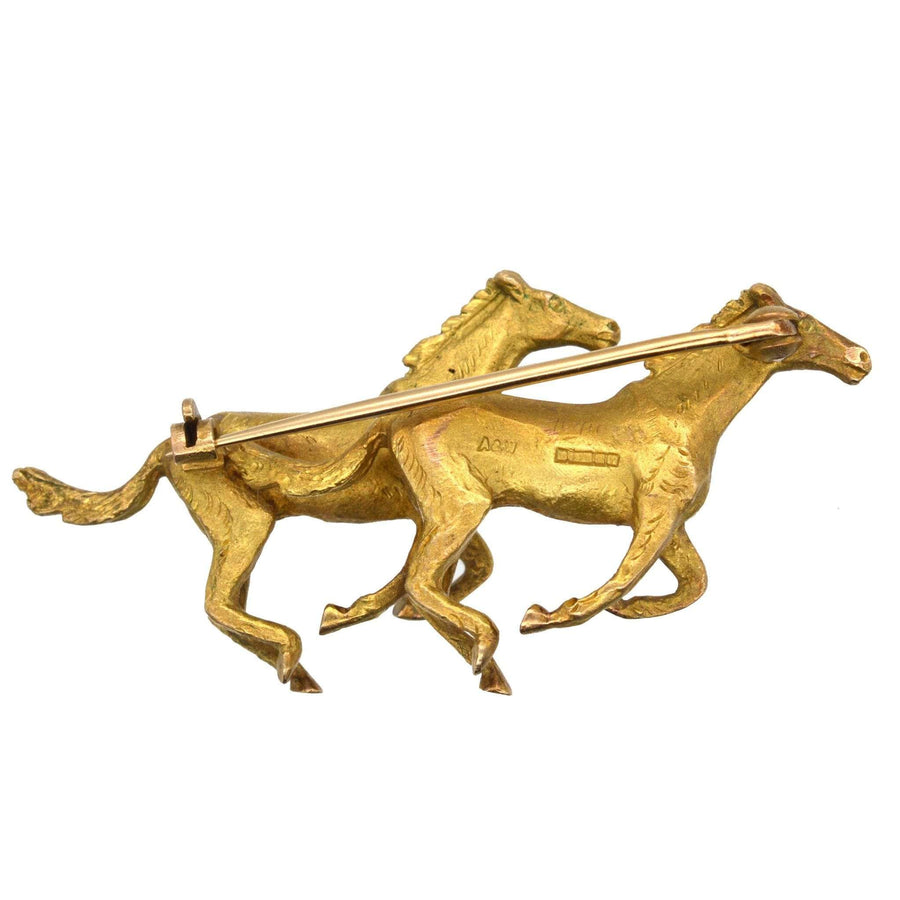 1940s 9ct gold brooch featuring two galloping horses by Alabaster & Wilson, crafted in Birmingham.