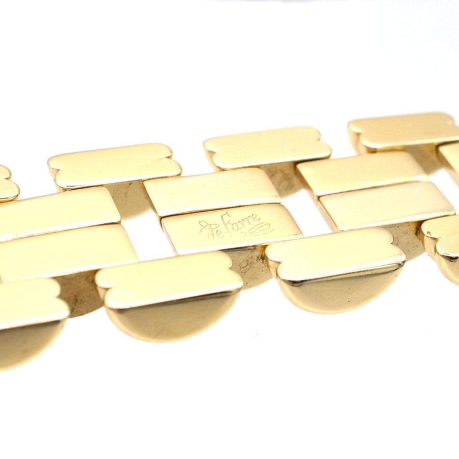 1940s geometric gold-tone tank bracelet by de Farre, showcasing retro elegance and iconic design elements.