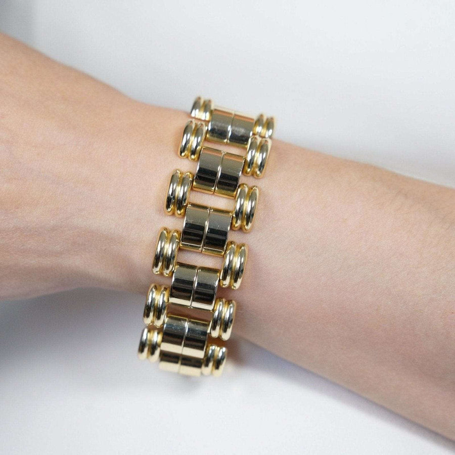 1940s French geometric gold-tone tank bracelet with moving shapes, inspired by post-WW2 design.