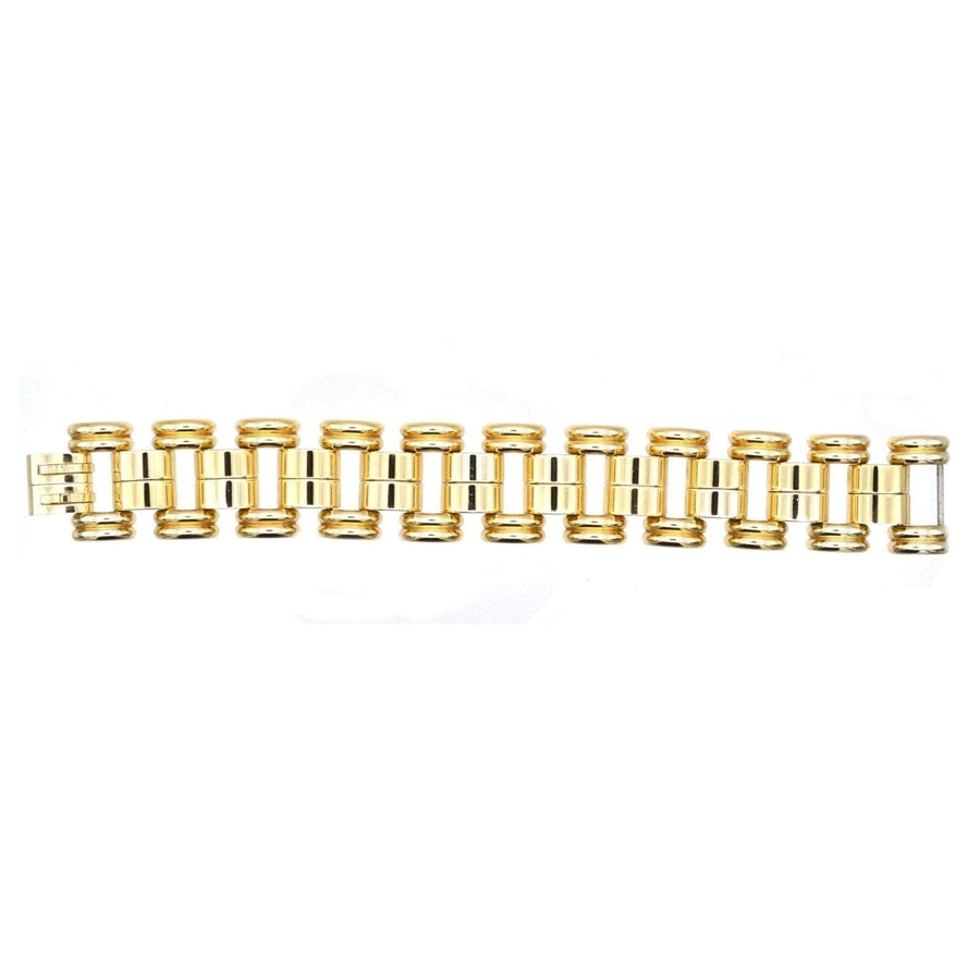1940s French geometric gold-tone tank bracelet by de Farre, featuring retro design and moving shapes.
